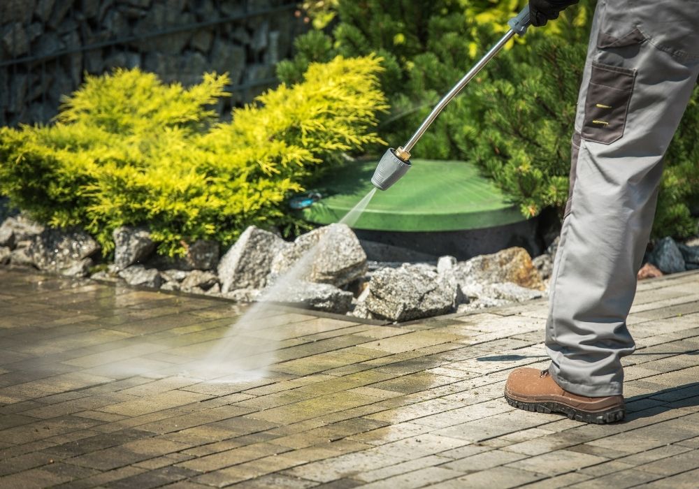 Professional pressure washing of an exterior surface